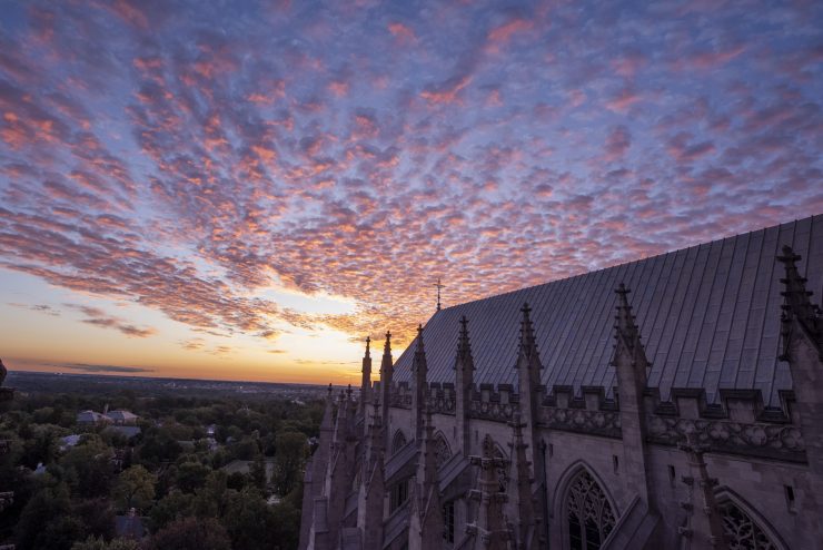 Cloudy sky at dawn over the roof of the Cathedral