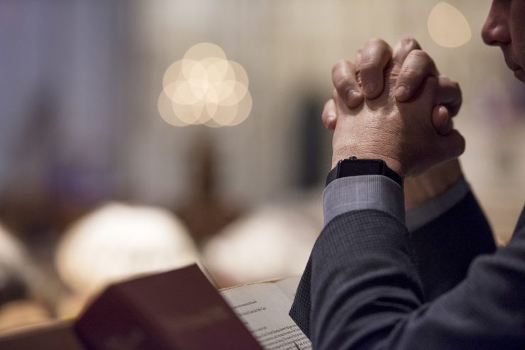 Man praying at the Cathedral