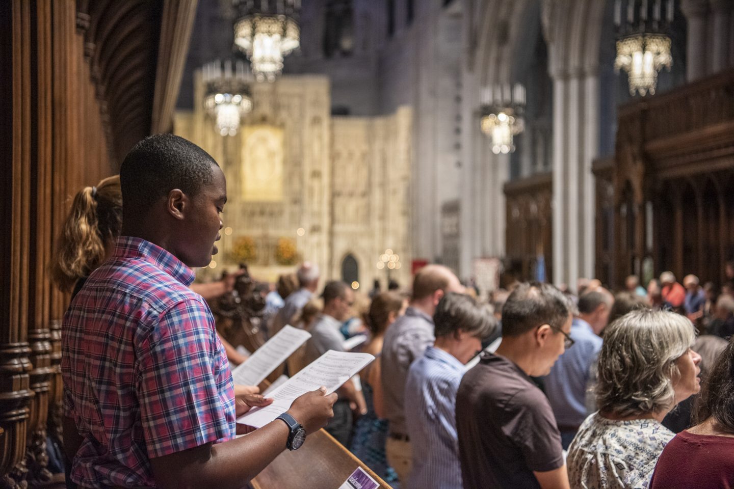 Worshippers singing during service in Cathedral's Great Choir