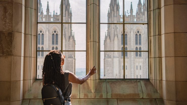 Visitor looking at Cathedral towers during tower climb tour